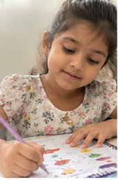 A child doing Mamapick worksheets